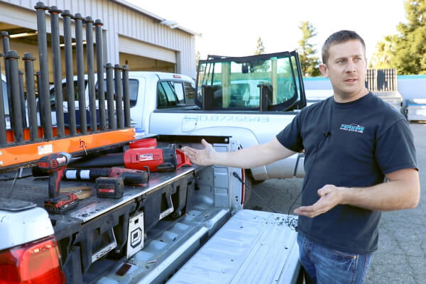 Technician with truck used for mobile glass repair
