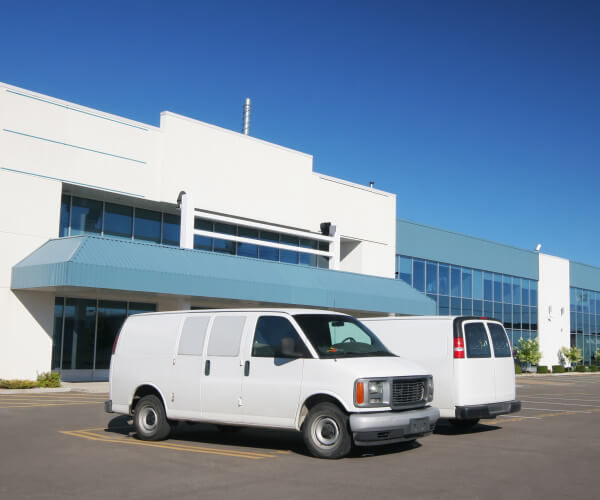 Locksmith vans in front of a building